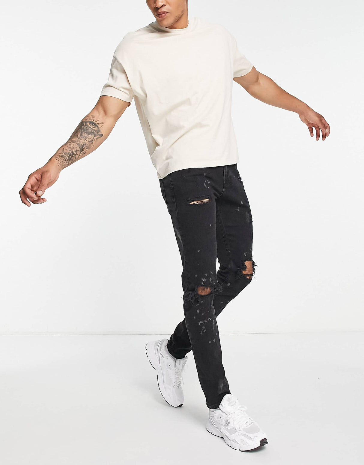 River Island Relaxed Skinny Jeans With Rips In Black