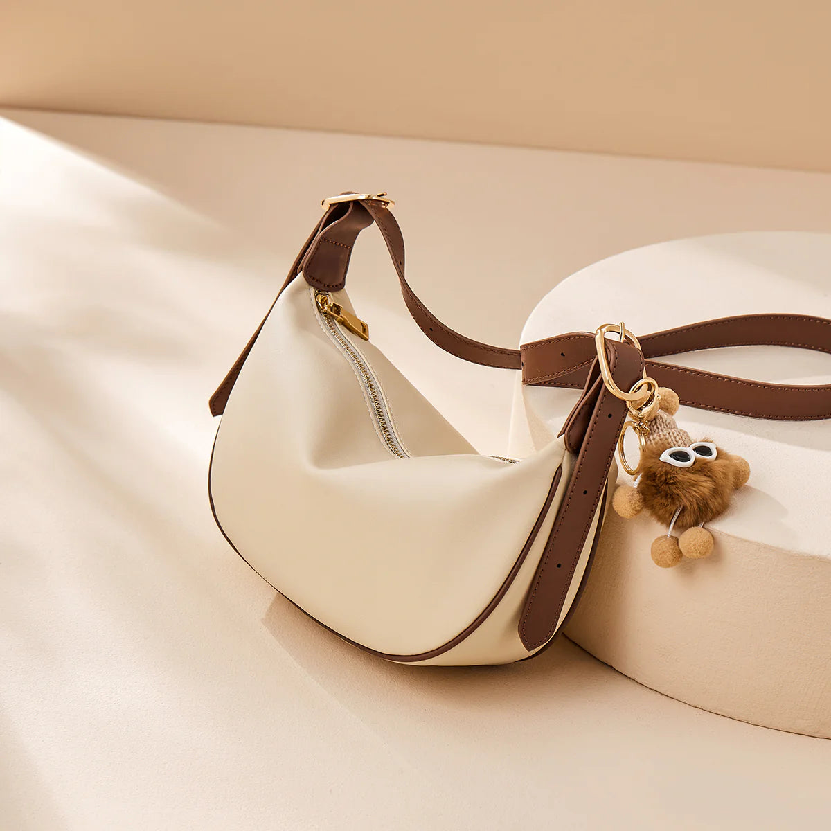 Nalandu Crescent Leather Crossbody Shoulder Bag with Bear Charm - Ivory