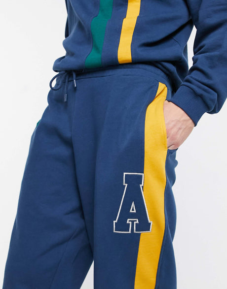 Asos Actual Co-Ord Oversized Joggers With Cut And Sew Stripes In Navy