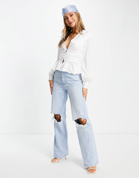 In The Style Exclusive Plunge Front Button Detail Top With Peplum Hem Detail In Ivory