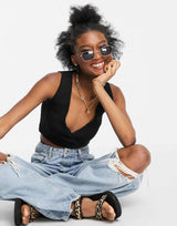 Asos Design Sleeveless Knitted Wrap Crop Top With Tie Detail In Black