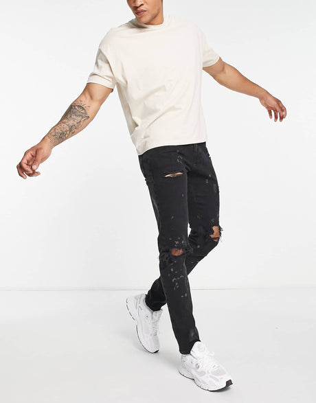 River Island Relaxed Skinny Jeans With Rips In Black