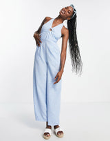 Qed London Halterneck Ring Detail Jumpsuit In Blue Floral Print