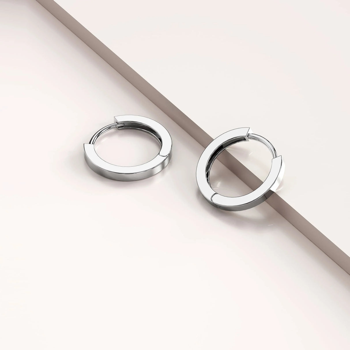 Solid 925 Sterling Silver Jerald Huggie Earrings in Silver