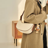 Nalandu Crescent Leather Crossbody Shoulder Bag with Bear Charm - Ivory
