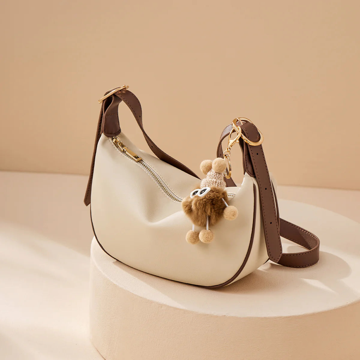 Nalandu Crescent Leather Crossbody Shoulder Bag with Bear Charm - Ivory