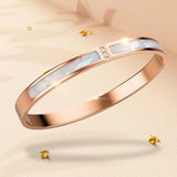 Boxed Modest Hinged Bangle & Round Interlock Earrings Set in Rose Gold