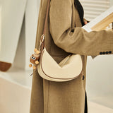 Nalandu Crescent Leather Crossbody Shoulder Bag with Bear Charm - Ivory