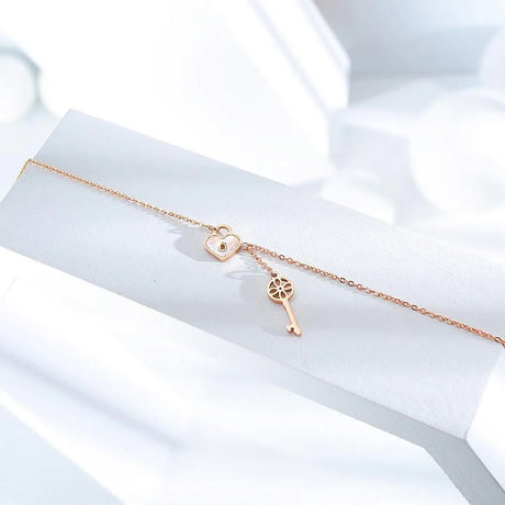 Bullion Gold Flower pattern key & lock in Rose Gold Layered Steel Jewellery